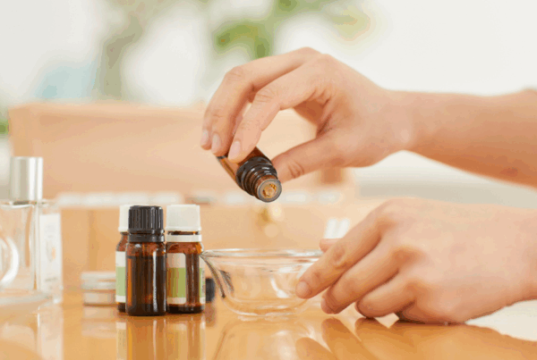 A mother mixes essential oils together for natural sinus relief.