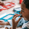 A young boy eating a healthy meal, one of the natural ways to reduce sinus inflammation and support overall health.